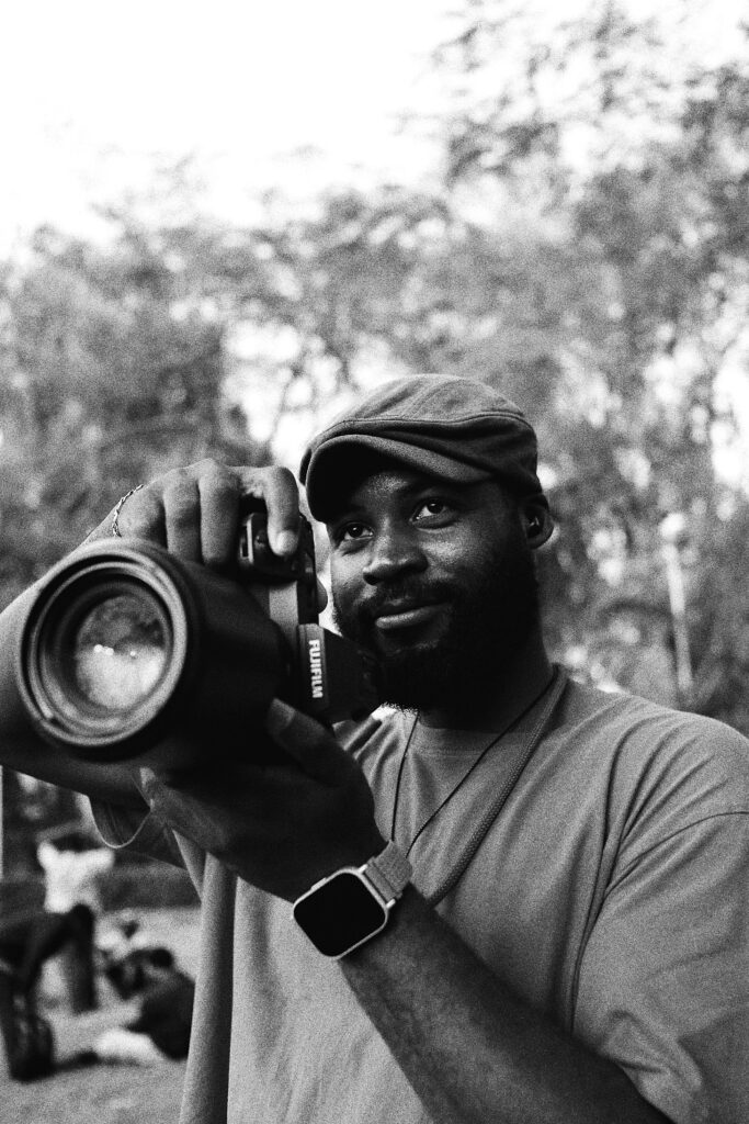 Why Tech Skills Are the New Degree in Nigeria Black and white portrait of a photographer at work in Abuja, Nigeria.